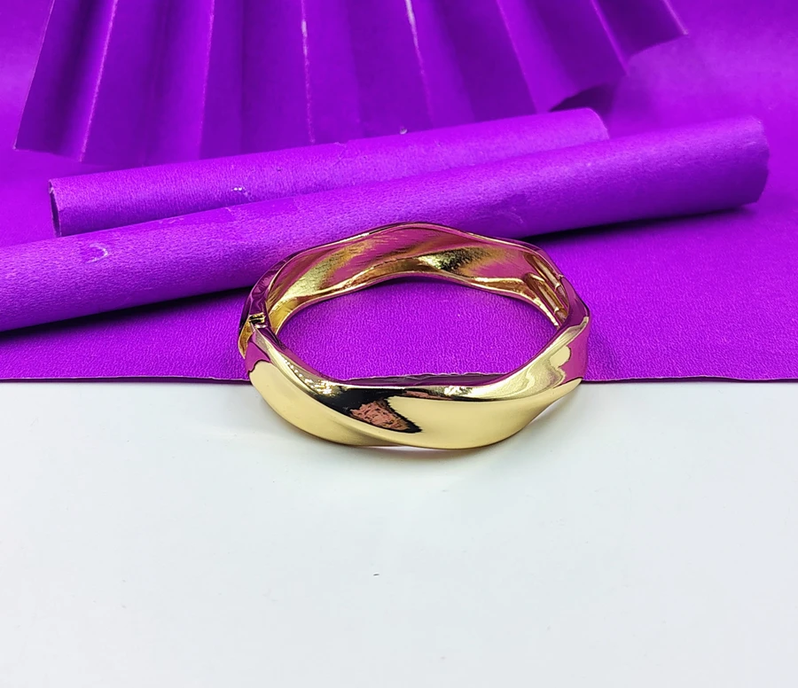 Bold Golden bracelet sculptural design.